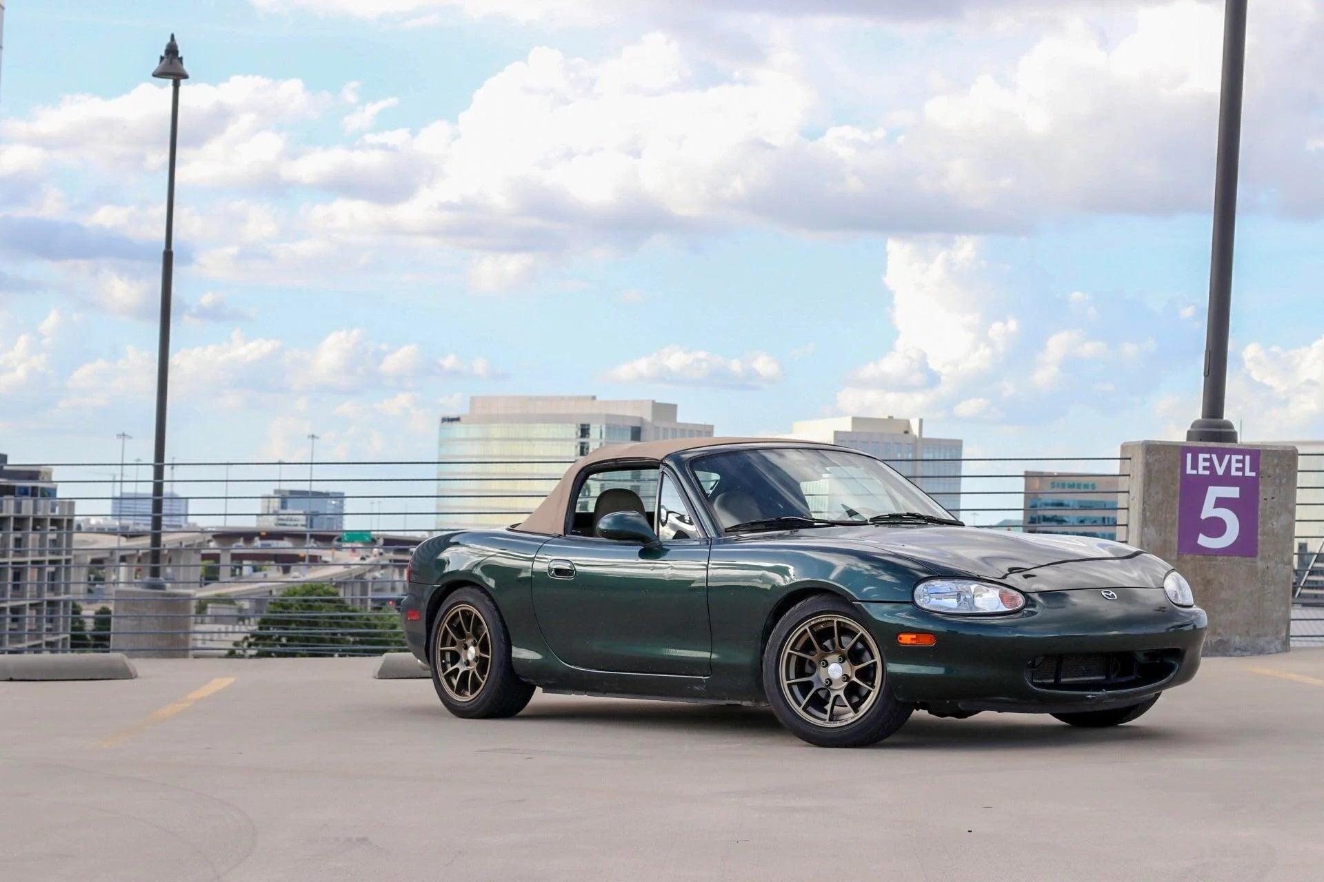 Green Mazda Miata with Jongbloed Racing Wheels Model S500 / Series 500 15 inch 4x100 All Satin Bronze