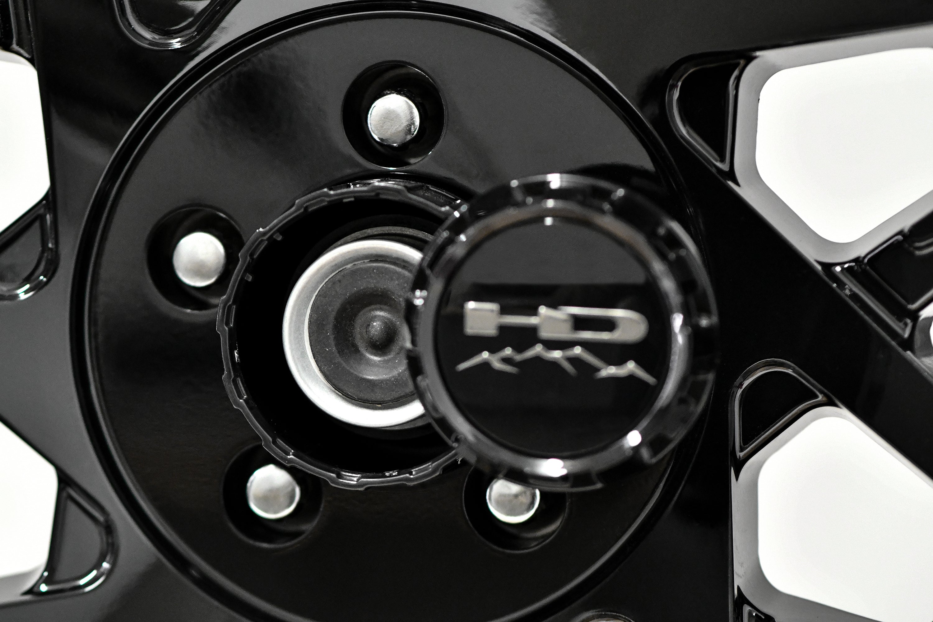 HD Trailer Serviceable Trailer Wheel Rim Center Hub Cap with Removable End for Easy Access to Service Axle Bearing Buddy without having to remove the wheel.