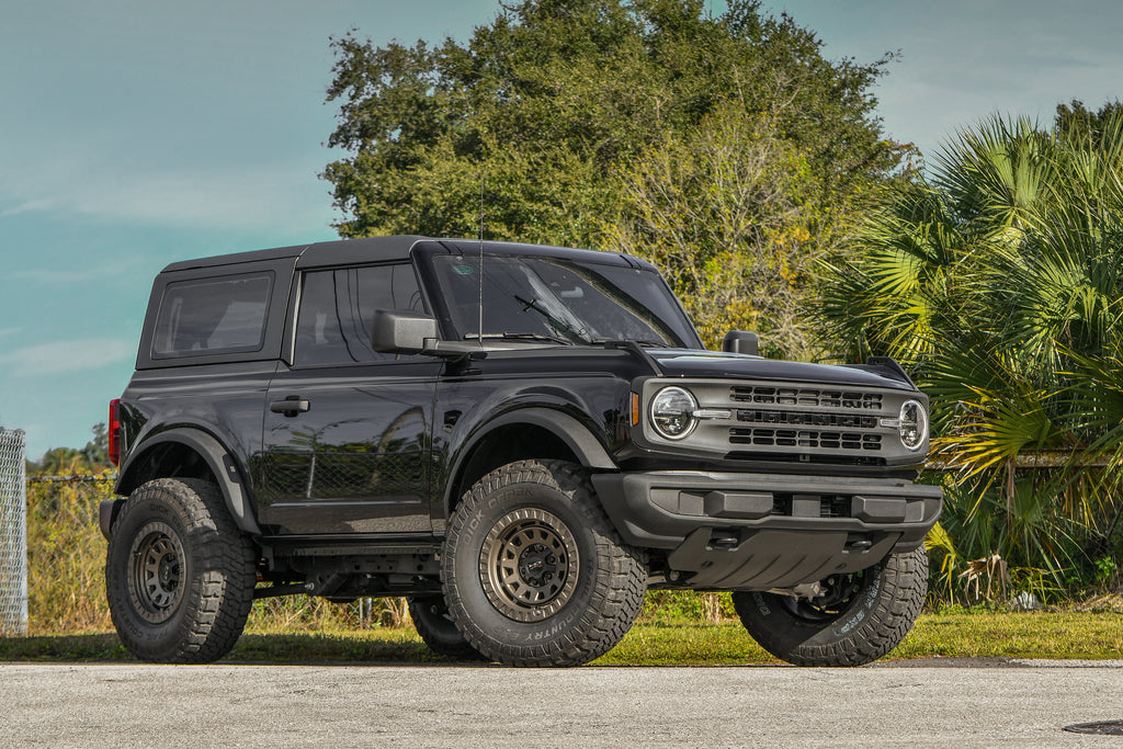 2022 Ford Bronco Black Lifted with 35 Inch Tires and the HD Off-Road Wheels Overland Sector Venture in 17x9.0 Satin Bronze with a 0mm Offset