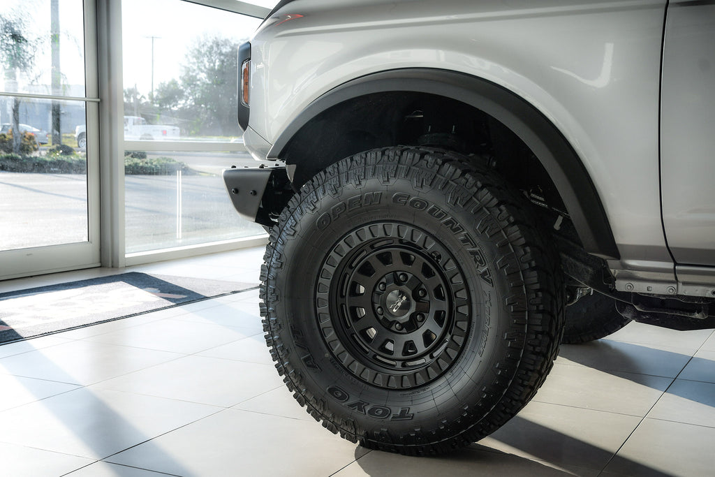 All New Lifted FORD Bronco 2 Door Silver with the HD Off-Road Wheels VENTURE Overland Sector Adventure style wheels in 17x9.0 with 35 inch all terrain tires.