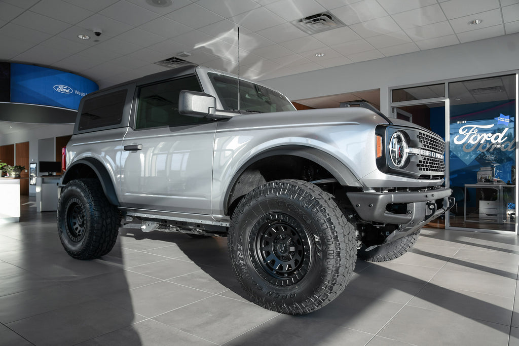 All New Lifted FORD Bronco 2 Door Silver with the HD Off-Road Wheels VENTURE Overland Adventure style wheels in 17x9.0 with 35 inch all terrain tires.