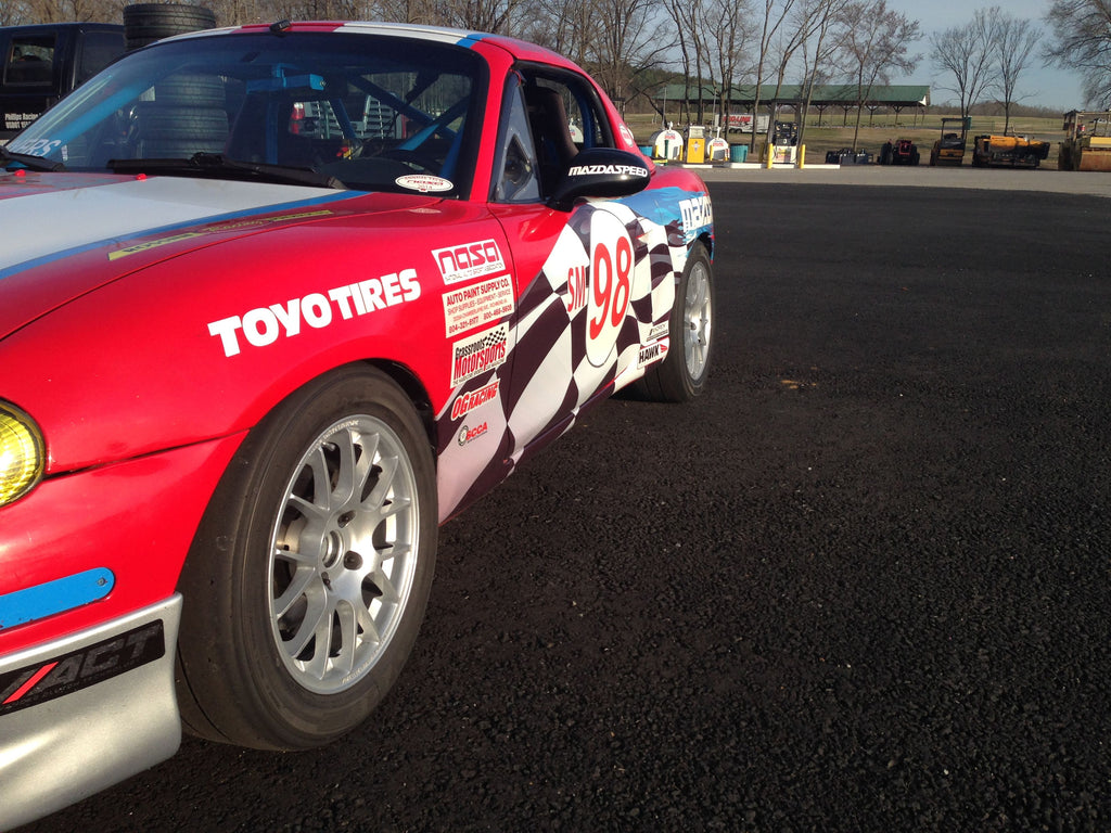 Jongbloed Racing Wheels Spec Miata Wheels in 15x7.0 4x100 25mm Offset in Silver on Red Track Racecar NASA SCCA